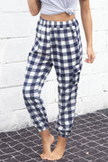 Fashionable cargo pants in plaid pattern with elastic high waist, perfect for casual outings.