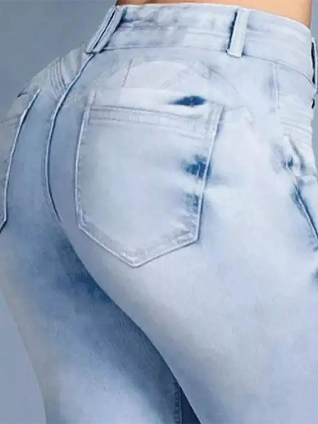 Plus size flare denim showing a close-up of the back view with a light wash and curvy fit.
