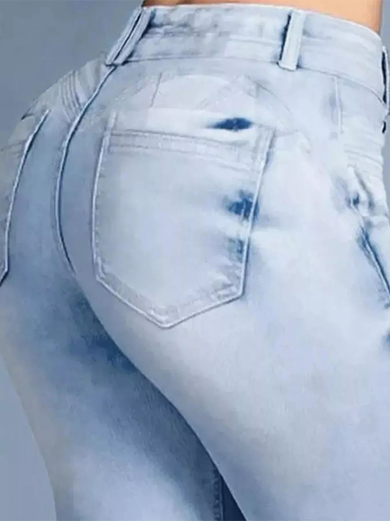 Plus size flare denim showing a close-up of the back view with a light wash and curvy fit.