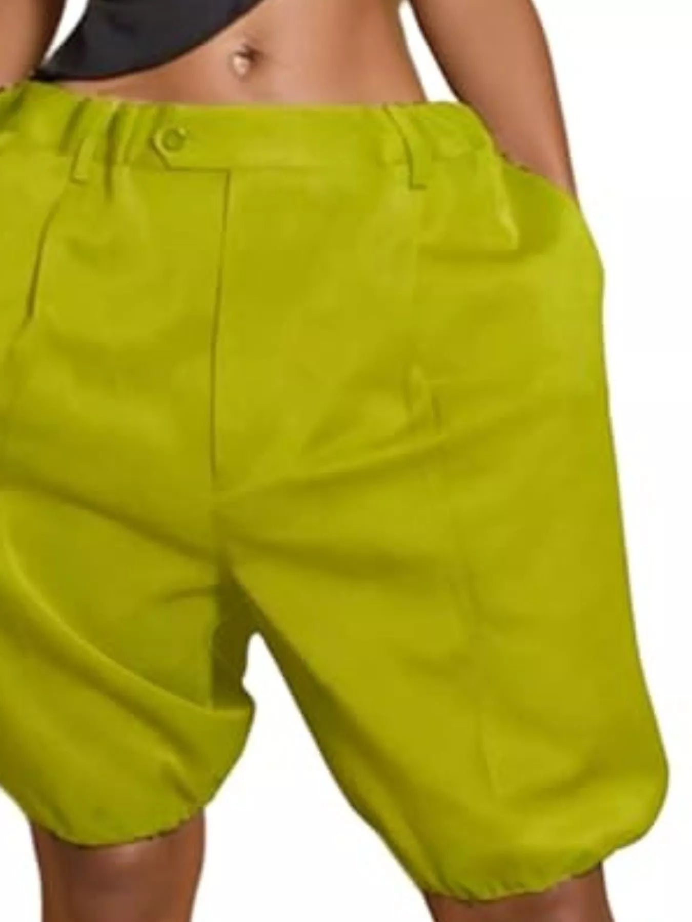 Bright green women's pleated shorts with pockets and high-waisted design.