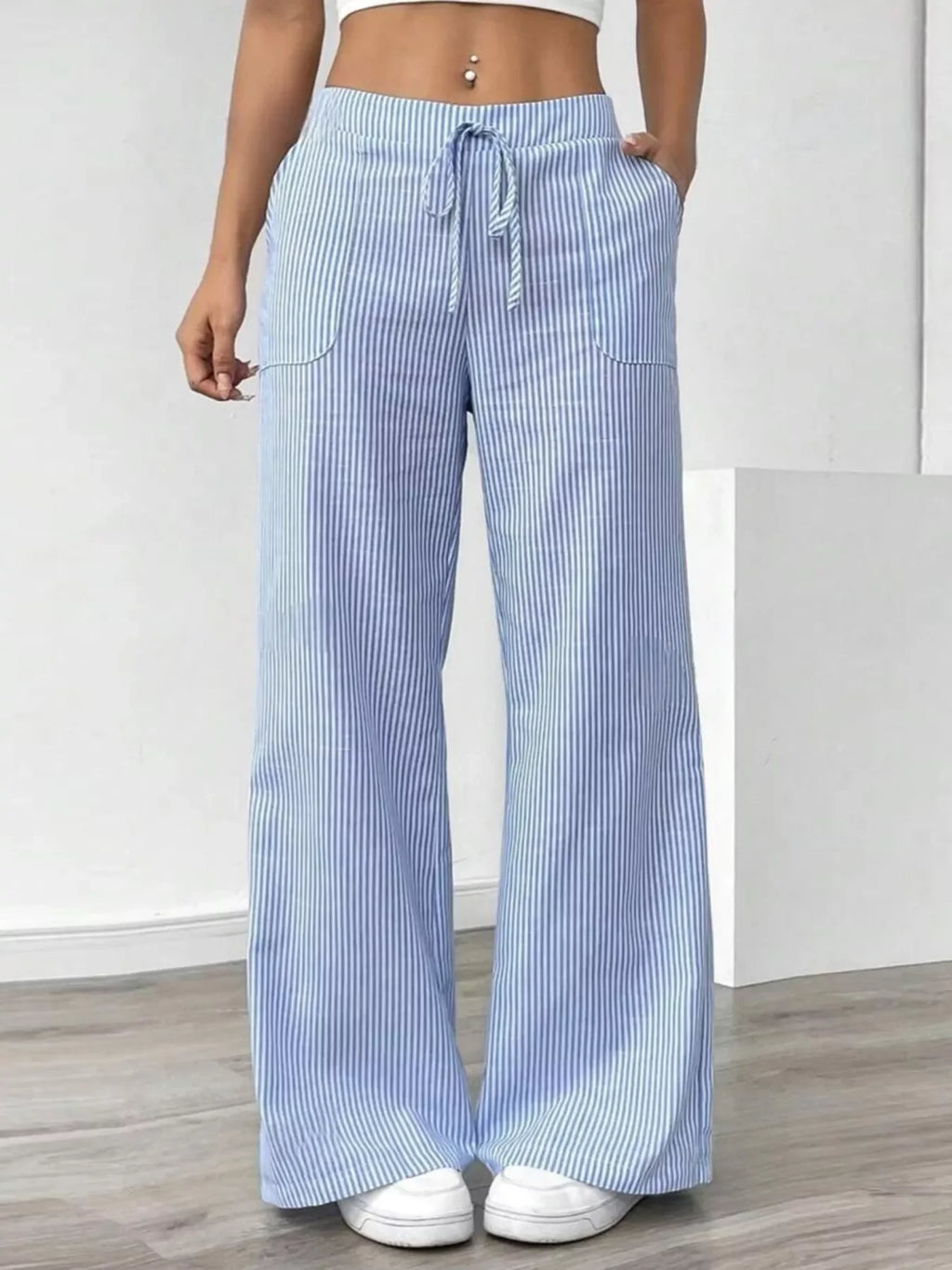 Striped Wide Leg Pants in light blue with pockets, featuring a comfortable drawstring waist and a stylish wide-leg design.