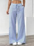 Striped Wide Leg Pants in light blue with pockets, featuring a comfortable drawstring waist and a stylish wide-leg design.
