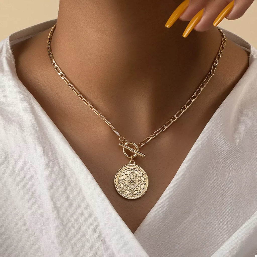 Chain Link Necklace with Vintage Coin Pendant worn on a model, showcasing its antique charm and bold design.