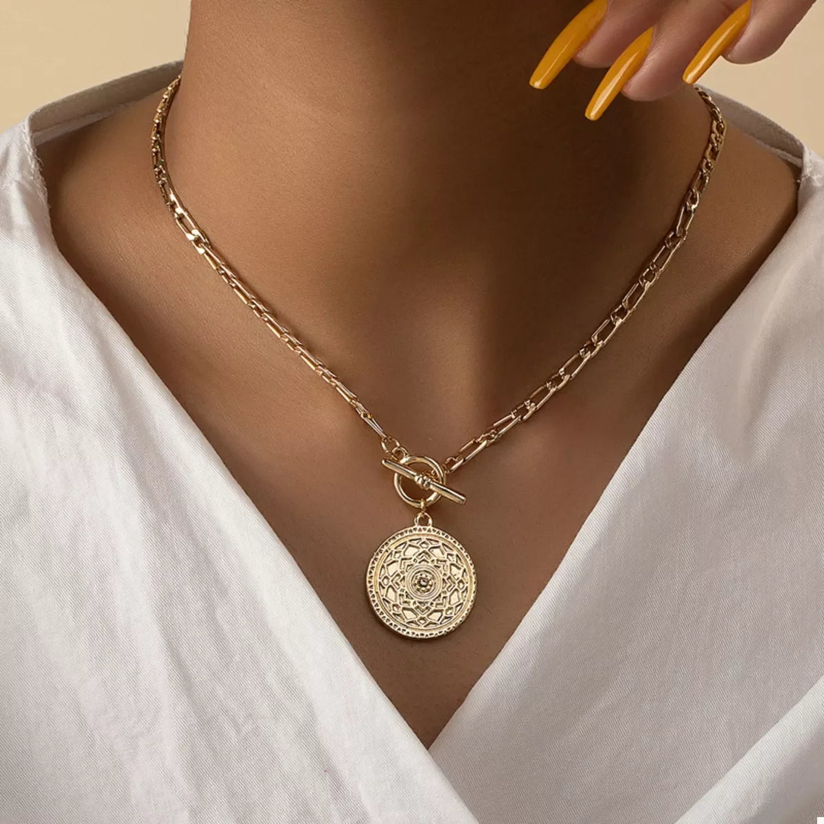 Chain Link Necklace with Vintage Coin Pendant worn on a model, showcasing its antique charm and bold design.