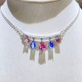 Teardrop Silver Necklace featuring colorful gemstones in pink and blue on a delicate silver chain.