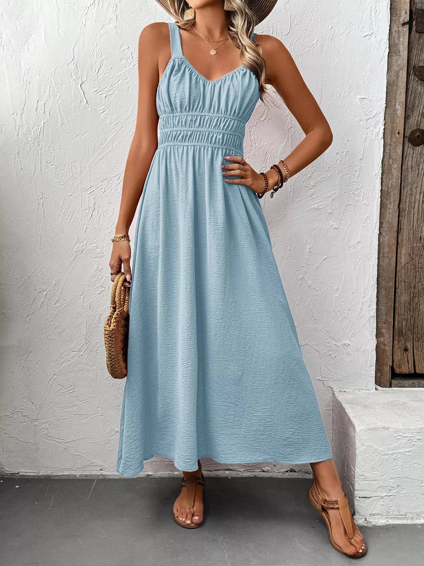 Midi dress for women sleeveless smocked casual in light blue showcasing a flattering fit and tied straps.
