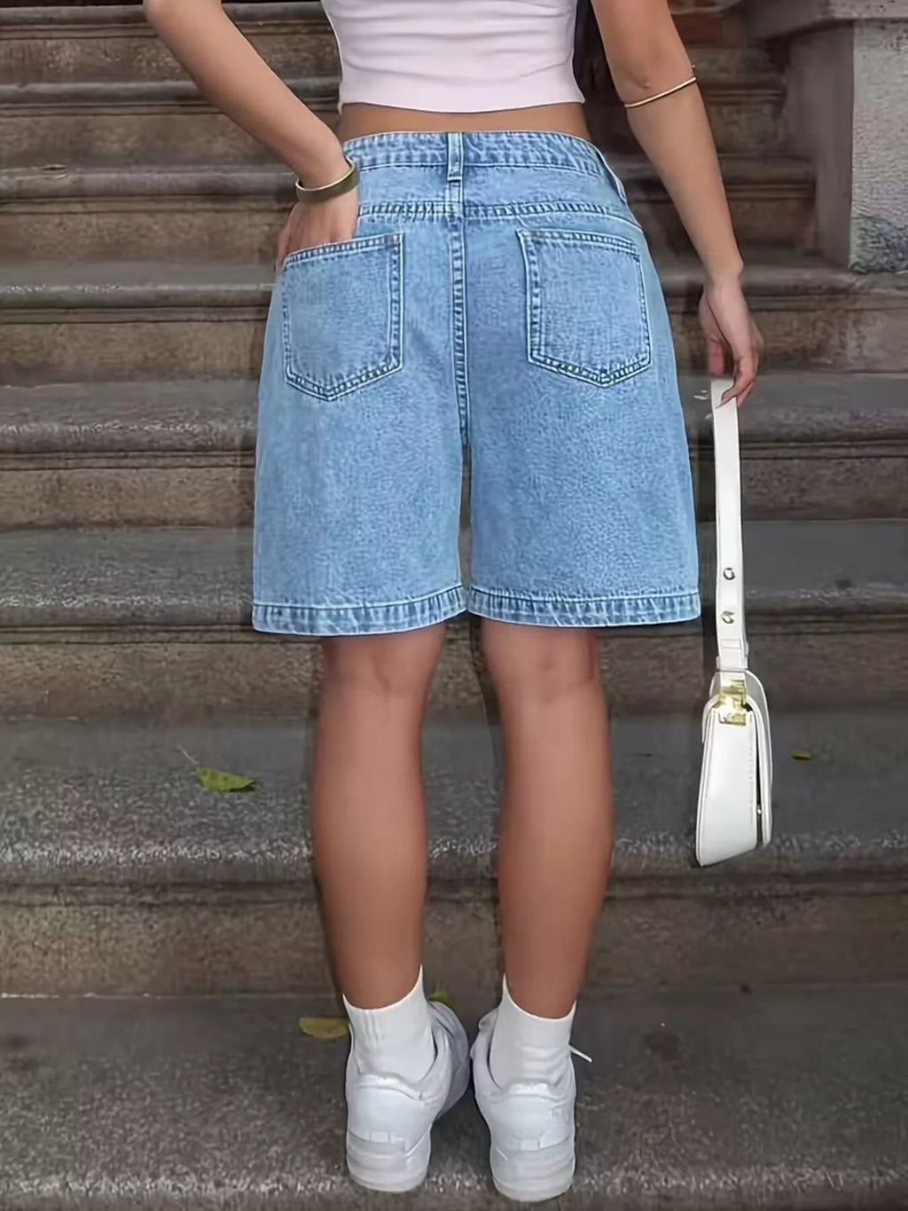 High waist denim shorts showcasing a relaxed fit, perfect for stylish summer wear with plenty of movement.