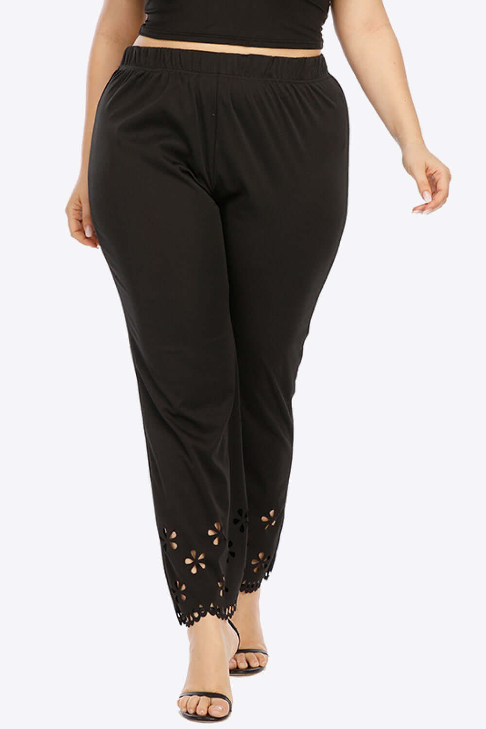 Plus size black pants for women with comfy openwork design and elastic waist, perfect for daily comfort and style.
