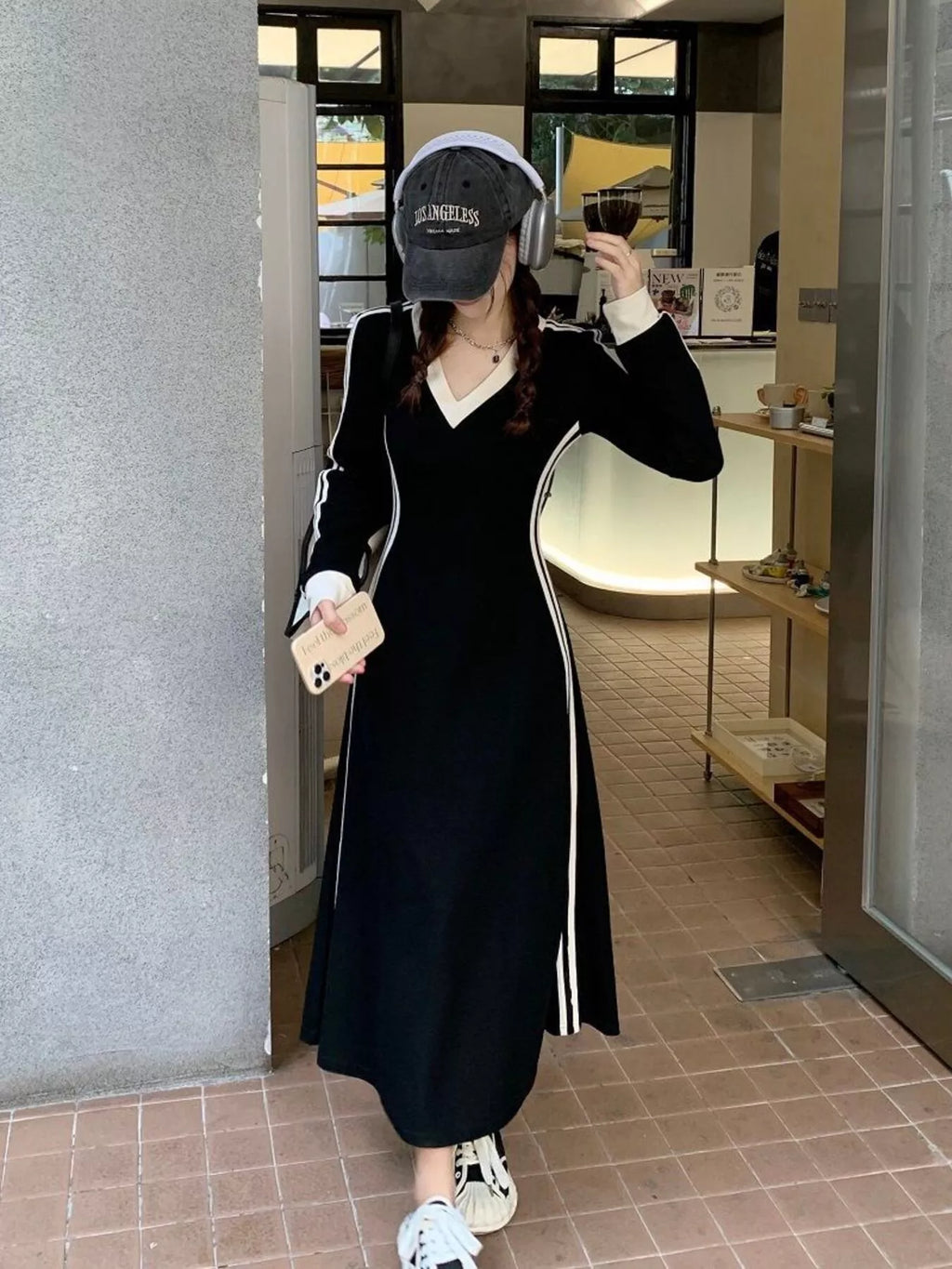 Long Sleeve Plus Size Dress V-Neck Long Sleeve Bodycon Midi Dress with Side Stripes worn by a woman in a stylish café.