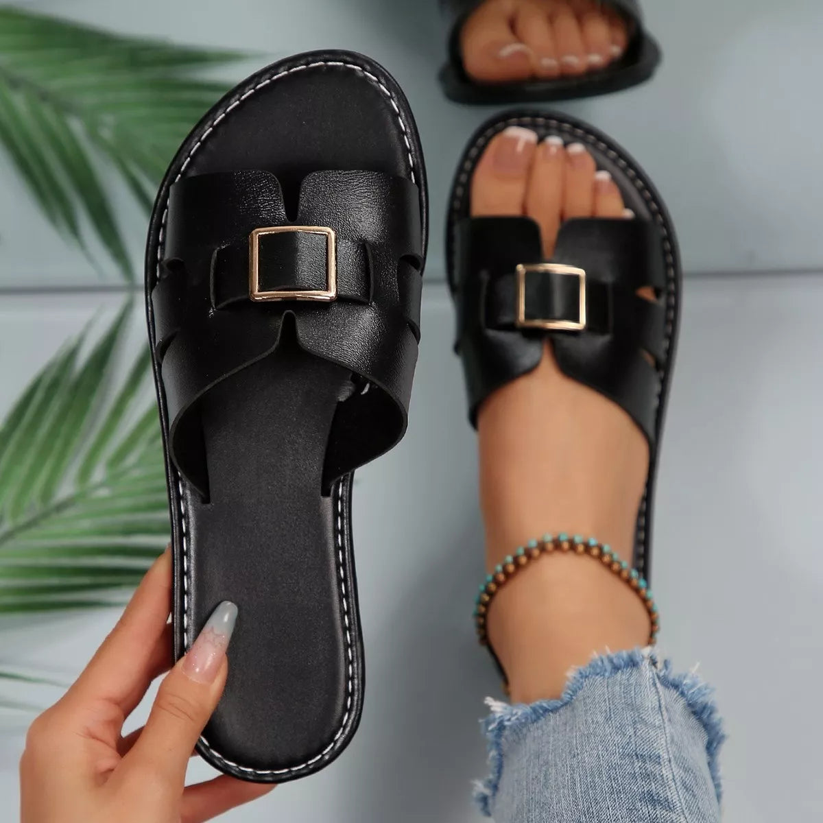 Women's Slide Sandals in black with elegant buckle, perfect for casual and summer occasions.