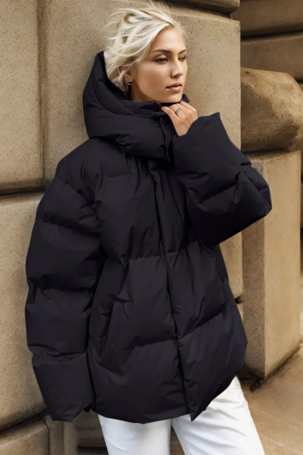 Pocketed Zip Up Hooded Puffer Jacket – Women’s Warm Winter Outerwear in black worn stylishly by a woman.