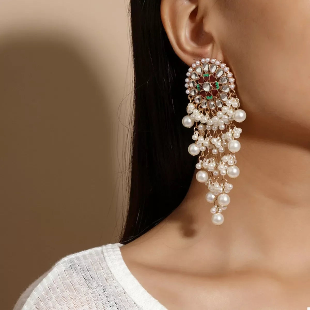 Elegant pearl fringe dangle earrings showcasing faux pearls and dazzling chains for a sophisticated look.