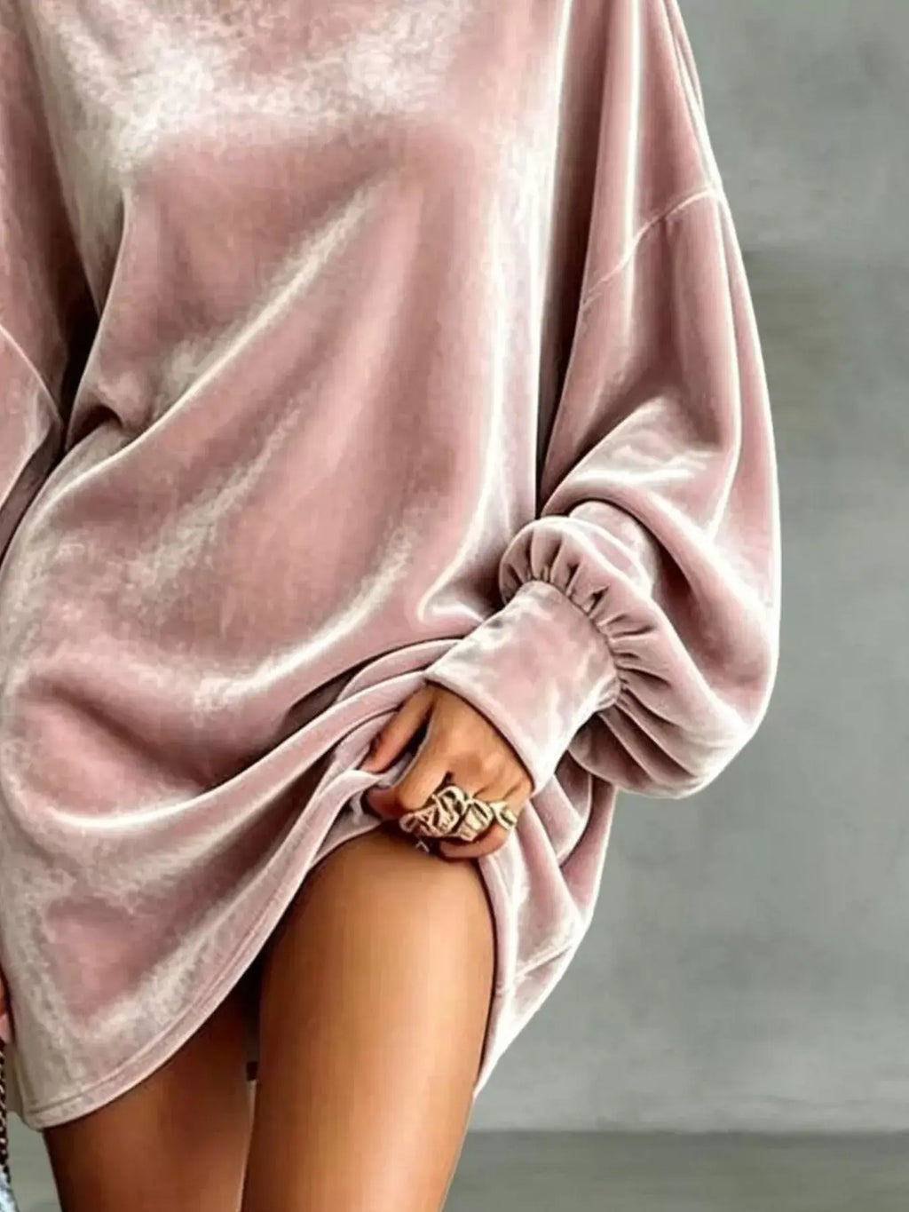 Plus size velvet mini dress featuring a chic pink design with stylish puffed sleeves.
