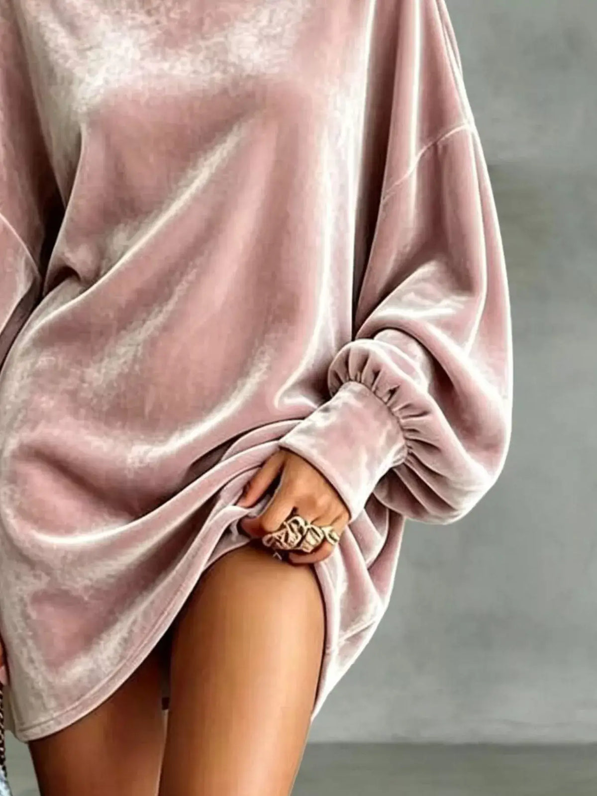 Plus size velvet mini dress featuring a chic pink design with stylish puffed sleeves.