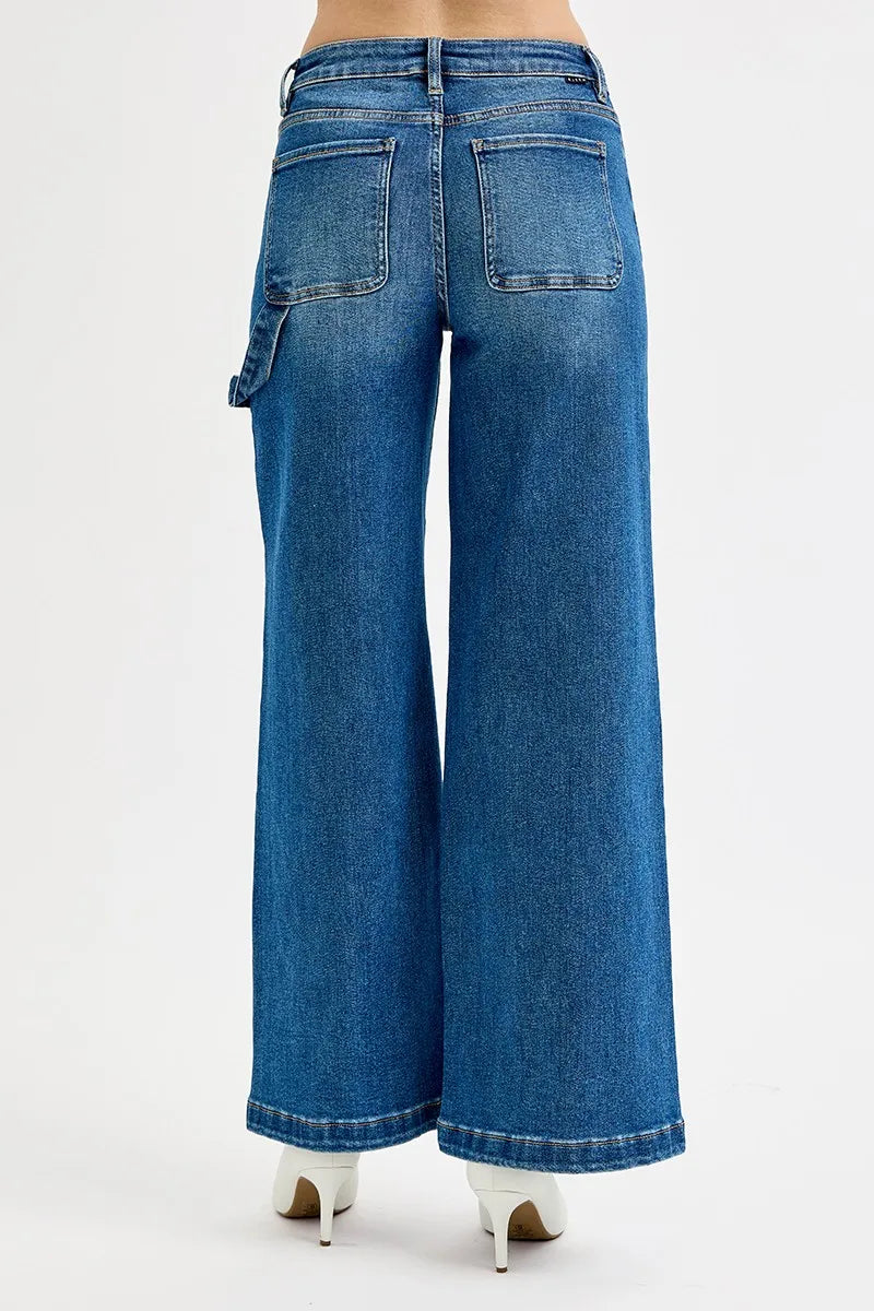 Back view of affordable plus size jeans featuring high rise and wide leg silhouette with unique patch details.