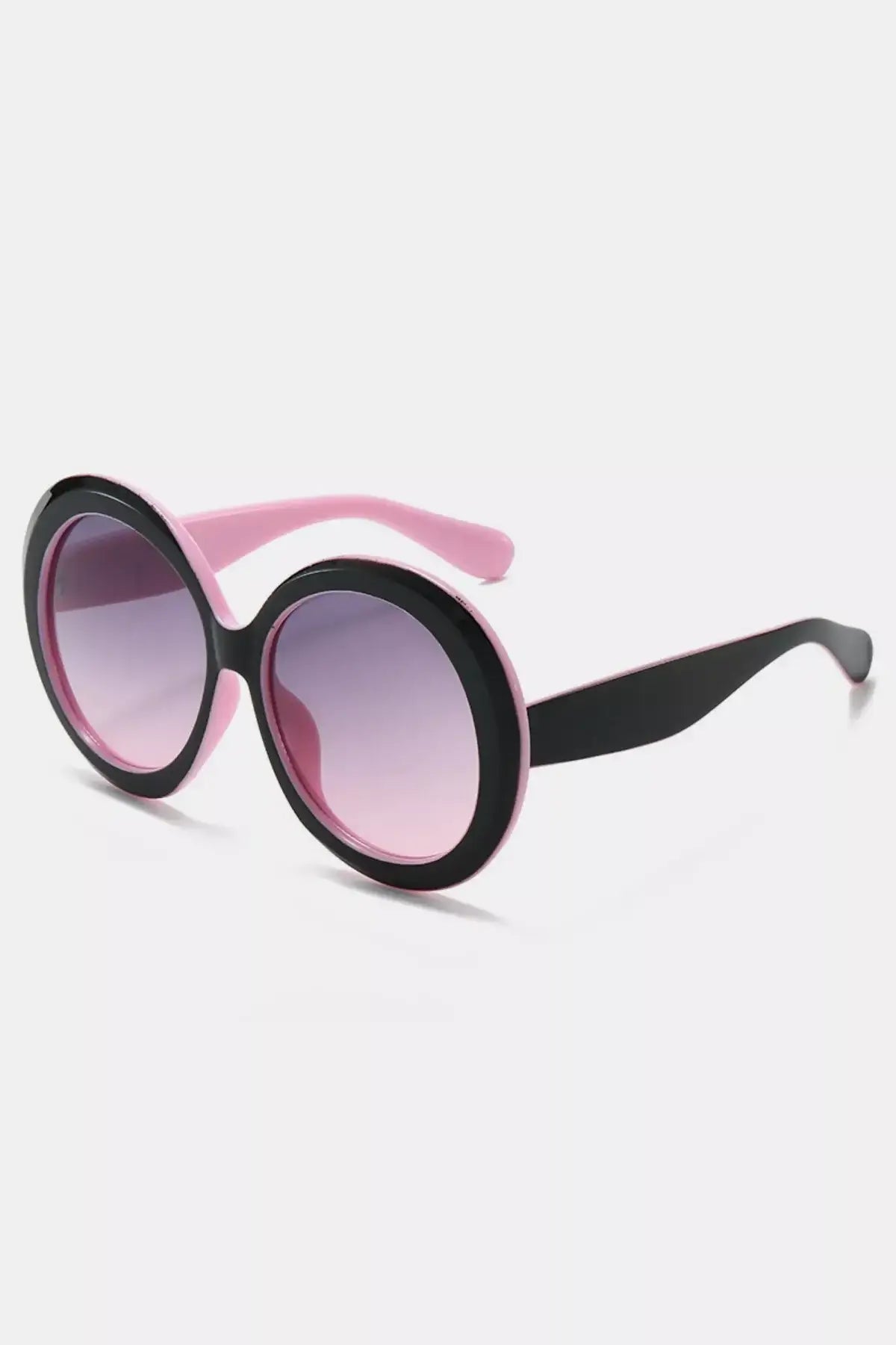 Oversized sunglasses for women in black and pink round frame design, perfect for a stylish look.