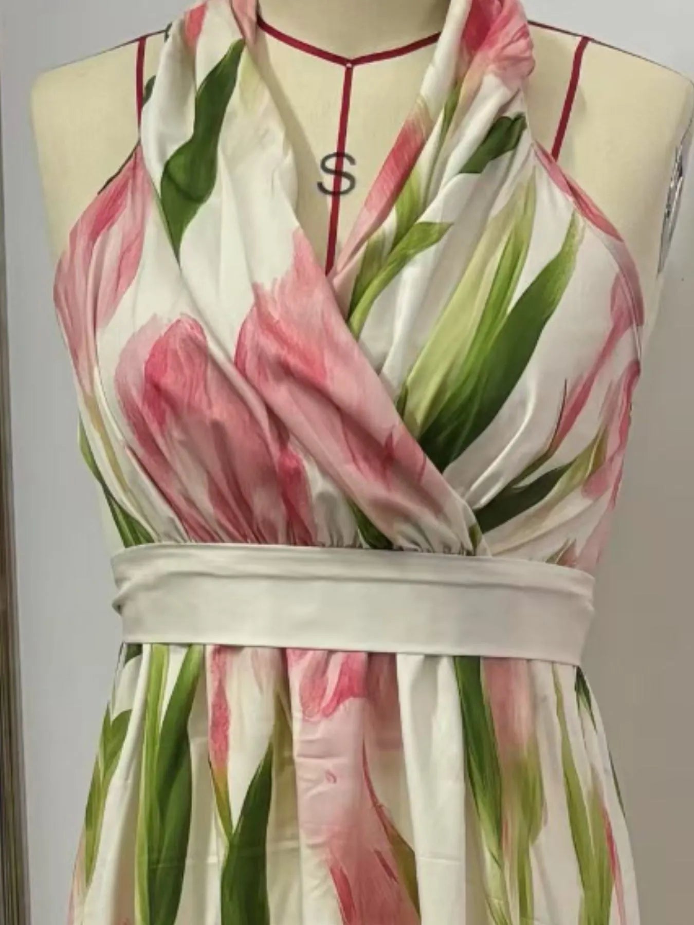 Floral Print Halter Neck Maxi Dress showcasing pink and green floral patterns on a halter neck style.