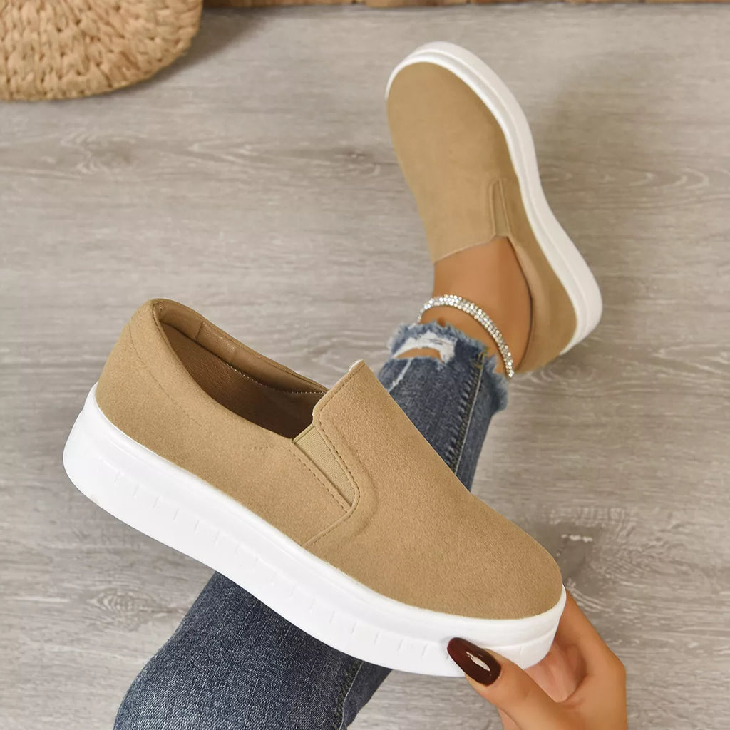 Slip-on platform shoes in beige color, featuring a round toe and cushioned sole, ideal for casual and stylish outfits.