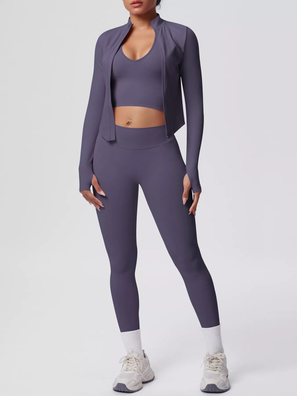 Stylish activewear featuring a tank, zip-up jacket, and leggings in a chic purple design.