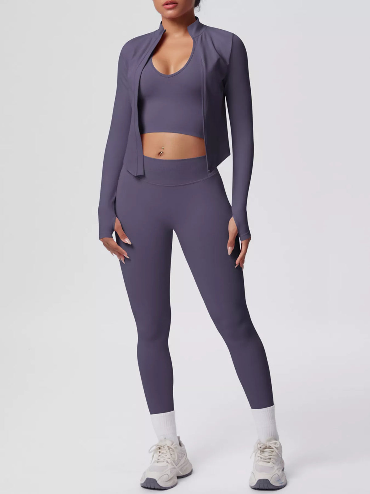 Stylish activewear featuring a tank, zip-up jacket, and leggings in a chic purple design.