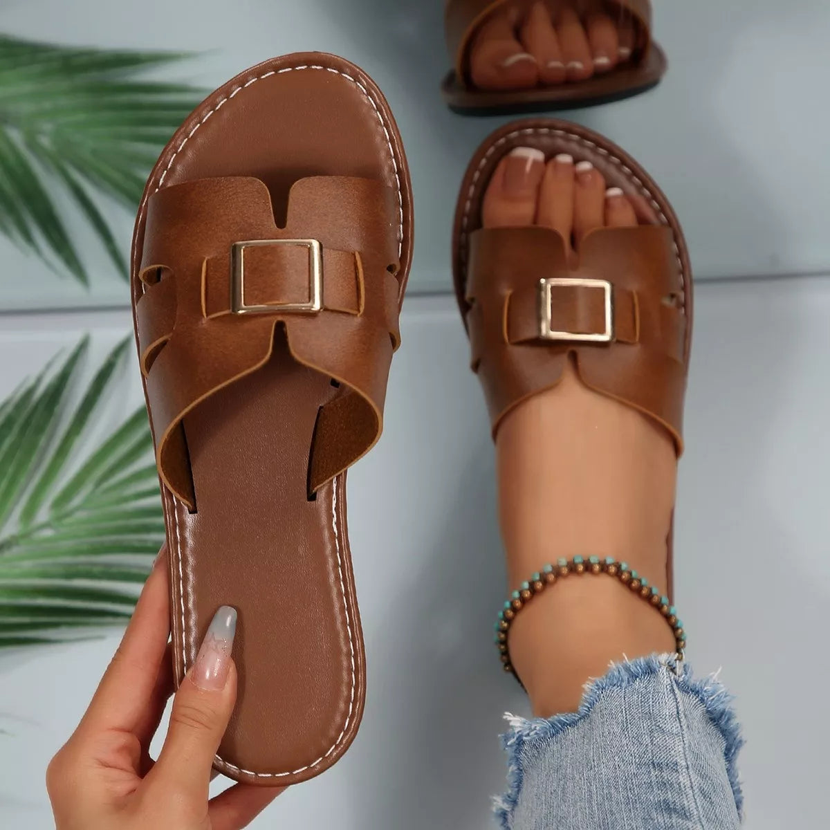 Women's Slide Sandals in brown with an elegant buckle, perfect for summer style and comfort.