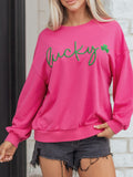 Lucky Clover Embroidered Loose Pullover Sweatshirt displayed on a model in pink with green embroidery.