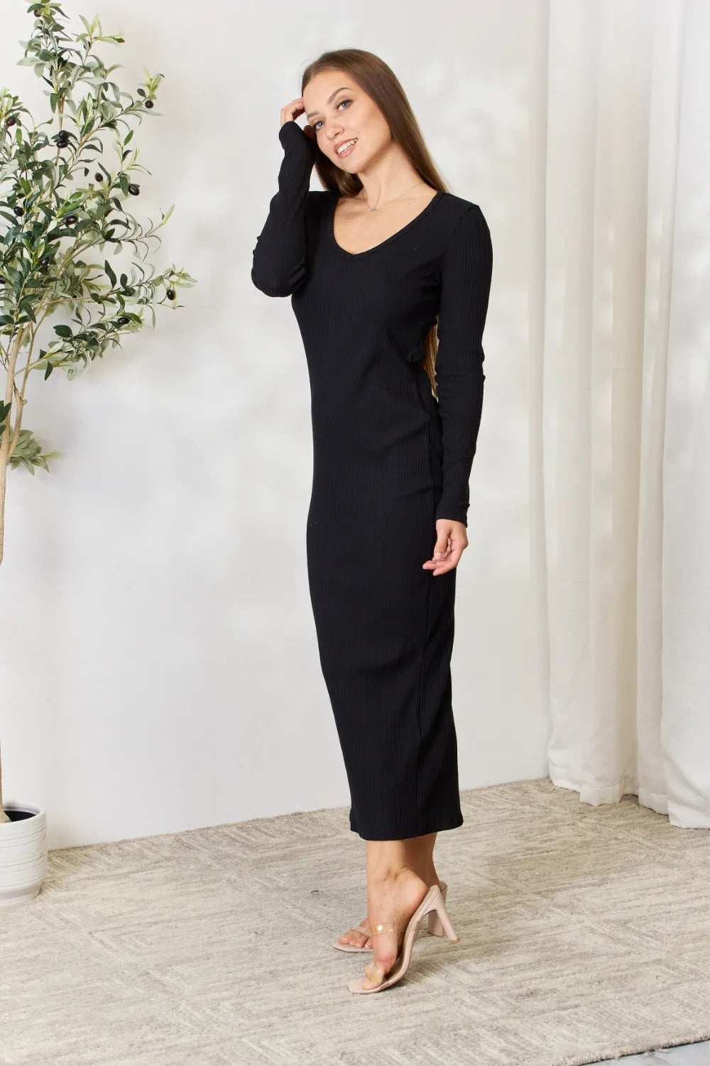 Fashionable midi dress featuring full size ribbed long sleeves and side slit, perfect for versatile styling.