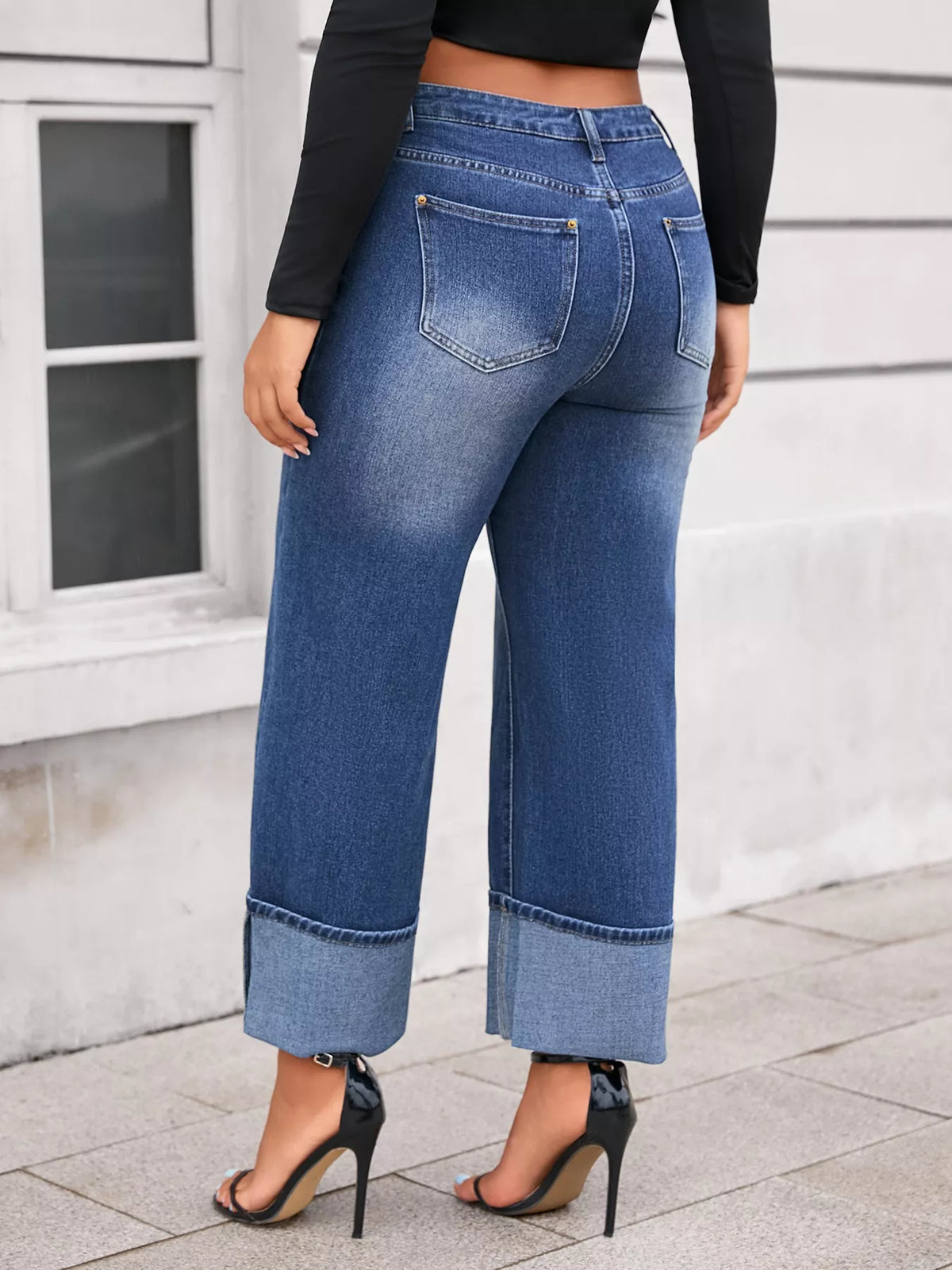 Plus Size High Waist Cuffed Wide Leg Jeans showcased from the back, highlighting the stylish cuffed hem and comfortable fit.