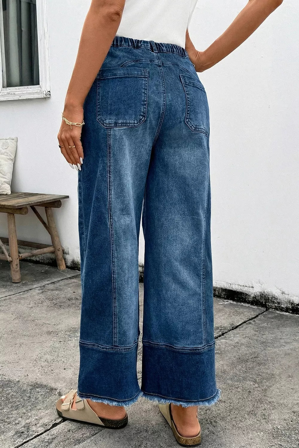 Wide leg jeans for women with drawstring seam and raw hem, showcasing a stylish back view for casual wear.