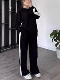 Full Size Surplice Short Sleeve Top & Pants Set – Women’s Plus Size Outfit (S–3XL) in black with white accents.