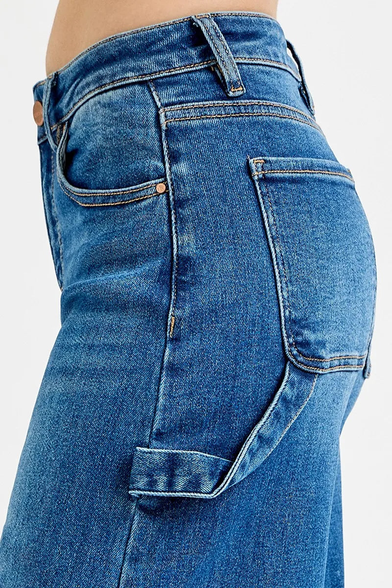 Affordable plus size jeans featuring high rise wide leg design and unique patch detailing.