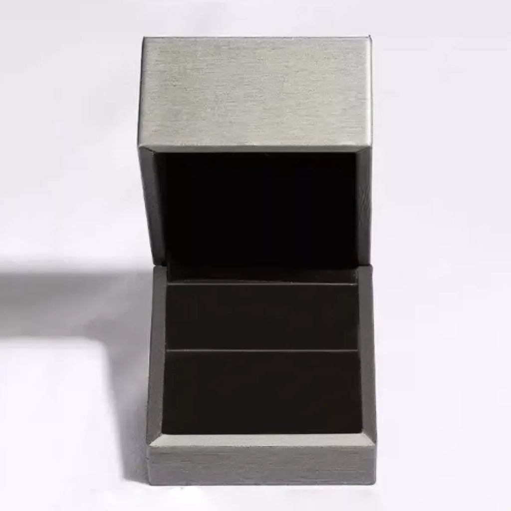 Open silver jewelry box for storing teardrop silver necklace and other elegant accessories.