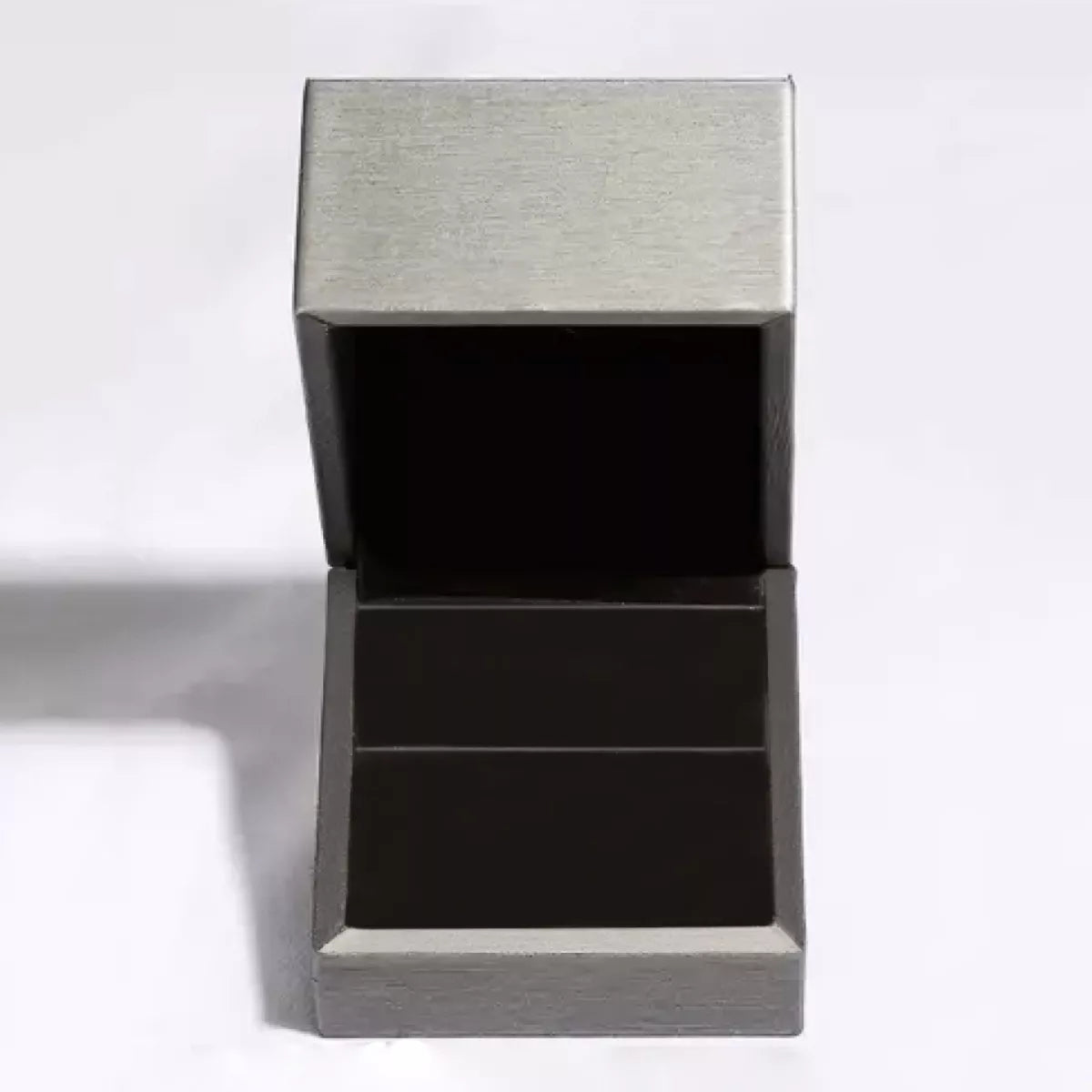 Open silver jewelry box for storing teardrop silver necklace and other elegant accessories.