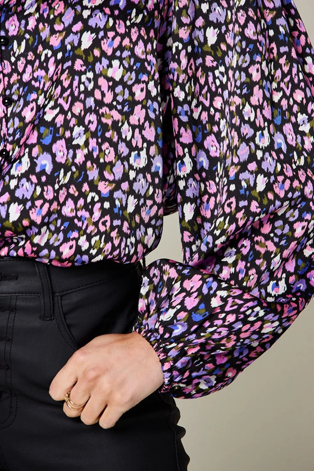 Metallic purple balloon sleeve shirt featuring vibrant floral pattern and stylish balloon sleeves.