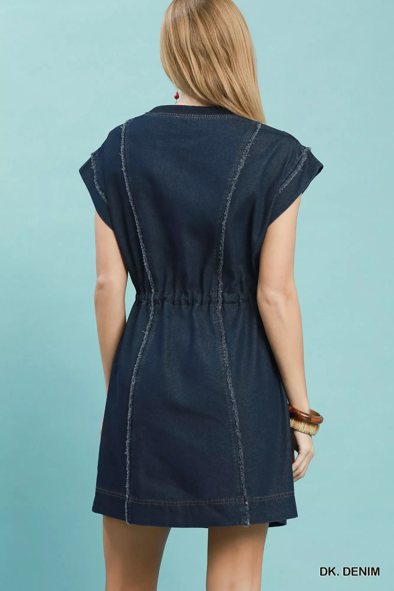 Back view of a casual dark navy denim mini dress with cap sleeves and adjustable drawstring waist.